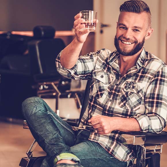 man-drinking-whisky-at-barber
